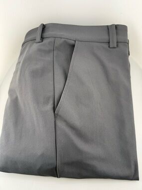 Tailored stretch
100% Polyester w 38  Inseam 35
L 45 from waist to hem